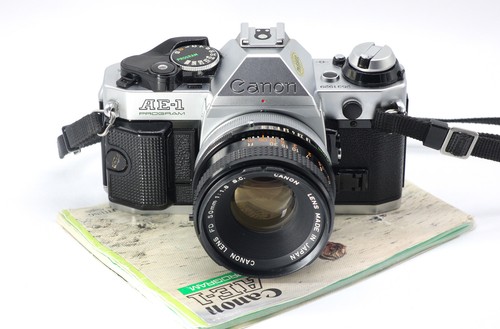 Canon program obiettivo - +,
